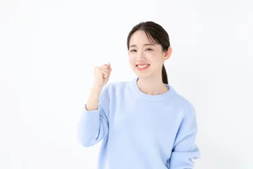 Fotobehang ガッツポーズする女性 © naka
