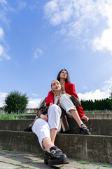 Female friendship with two young women spending time together in the park
