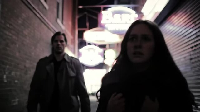 Tense encounter in dark alley as woman feels the presence of a man following her during late-night walk