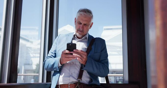 Mature man, phone call and lobby on business trip with contact, talking and listen for flight schedule. Senior person, smartphone and communication for transport, taxi or chauffeur by window at hotel