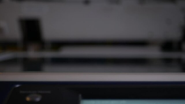 Close up office man using scanner panel the Office professional multi-function printer scanner for scanning document and printing. a Copy machines