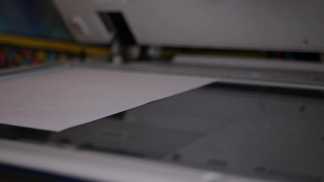 Close up office man using scanner panel the Office professional multi-function printer scanner for scanning document and printing. a Copy machines