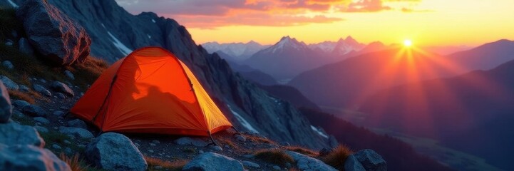 Lone sleeping bag on rocky mountainside at sunrise ,  high altitude,  sunrise