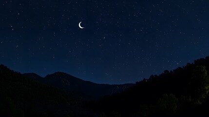 A serene night sky filled with stars and a glowing crescent moon