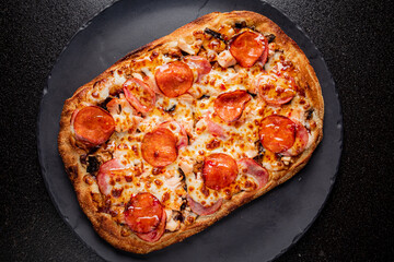 Warm, savory pepperoni pizza topped with melted cheese and crispy crust captivates the senses
