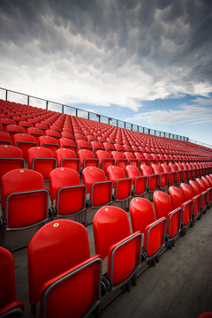 Empty red stadium seats before a sports event