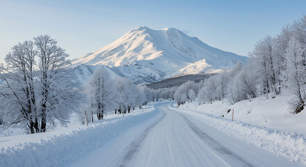 Fototapeta premium Winter Majesty: Snow-Covered Road to Majestic Mountain Peak AI Generated