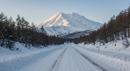 Fototapeta premium Serene Winter Road to Majestic Snow-Capped Peak AI Generated