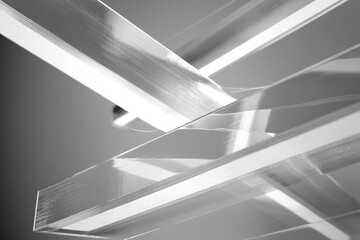  A mesmerizing study in geometric forms. Transparent glass structures intersect, casting intricate shadows and creating a sense of depth and dimension.