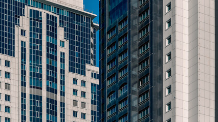 Fototapeta premium many windows and walls facade of a modern skyscraper without people