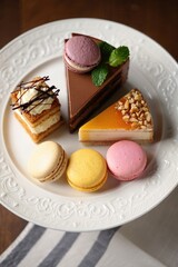 Delicious selection of colorful desserts on an elegant plate at a cozy cafe