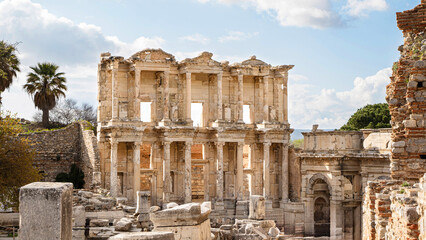 The Celsus Library at the end of the hill on Curetes Street in the ancient city of Ephesus, one of the 7 wonders of the world, under a slightly cloudy deep blue sky
