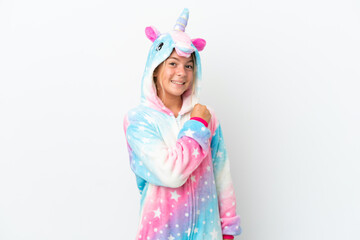 Little girl with unicorn pajamas isolated on white background celebrating a victory