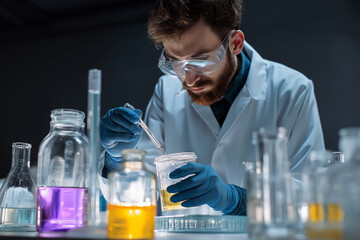 Male Chemist Analyzing Substance with Goggles &ndash; Stock Photography Style.