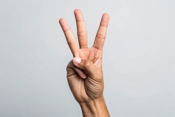 Close-up of a Hand Showing the Number Three