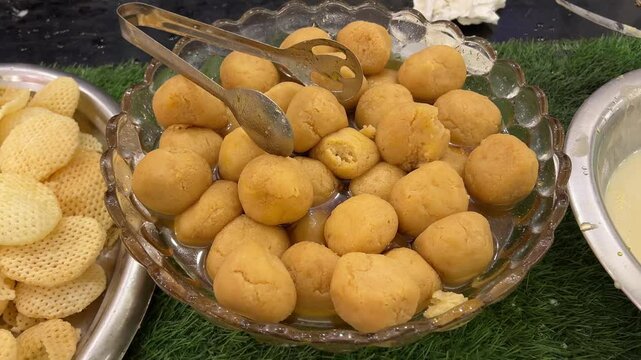 Close up shot of Komola bhog, a famous Bengali sweet dish