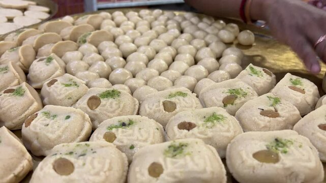 Close up shot of Nolen gurer Sandesh served in a plate in a shop in Bengal