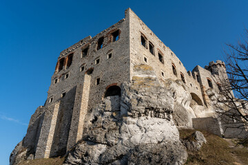 Medieval Castle Ruins with Round Tower and Stone Walls