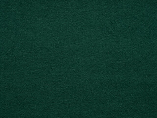 Textured dark green felt surface, exuding an essence of timeless sophistication and deep tranquility