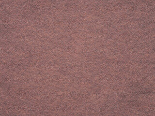 A dusky rose felt surface, echoing the subtle grace of an early twilight and the warmth of vintage charm