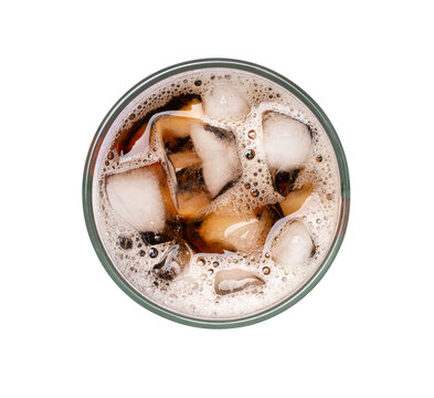 Glass of cola with ice cubes on white background. Top view	
