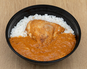 Indian tandoori chicken with white rice and curry sauce for traditional lunch visuals
