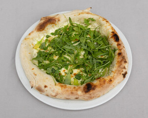 Pizza with fresh arugula and creamy cheese for healthy vegetarian Italian meal visuals