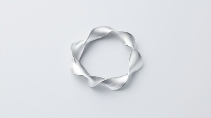 A silver bracelet with a twisted design.