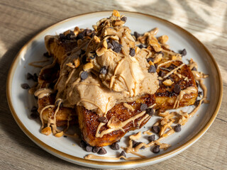 French toast with peanut butter, chocolate chips and whipped cream for gourmet breakfast or dessert visuals