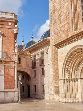 Almoina Square, or l&rsquo;Almoina Square, with a view of the Arch of Barchilla street, the Archbishop's palace and a gate of the Cathedral called Almoina Gate or Palau Gate. Valencia, Spain, Europe