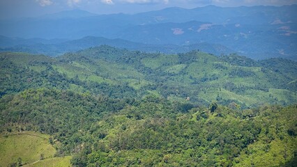 Panoramic view of beautiful green valley with blue sky. 
