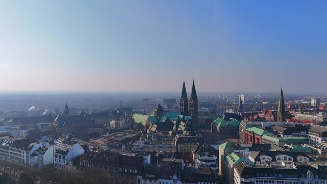 Drone Approaches Historic Bremen in Morning Fog
