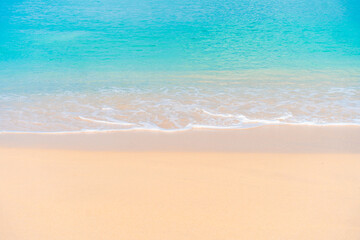 Peaceful tropical beach with turquoise water and soft white sand. Perfect summer vacation background.
