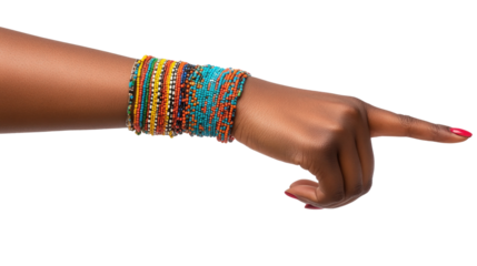 A close-up of a hand adorned with colorful bracelets, pointing towards a vibrant background, emphasizing cultural expression