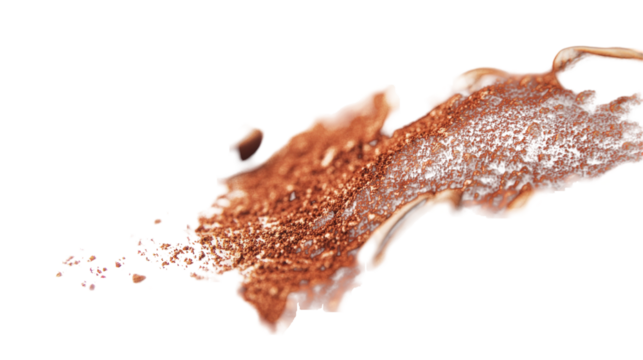 A close-up of shimmering copper powder spilling across a smooth surface, highlighting its texture and color