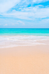 Scenic summer beach with turquoise sea, gentle waves, and soft white sand. Holiday travel concept.