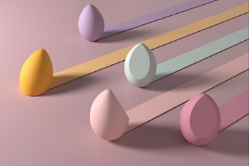 The image displays five makeup blending sponges arranged diagonally across a light pink surface.