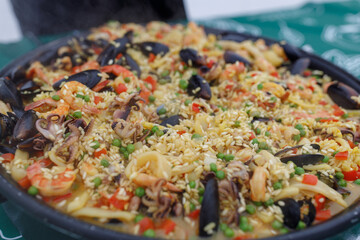 A detailed closeup view of a beautifully arranged plate of delicious food placed on a stylish table, showing intricate presentation