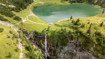 waterfall among german alps
in Bavaria  and mountains lake 