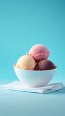 A trio of delicious ice cream scoops in a white bowl.