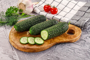 Raw green cucumbers with slices
