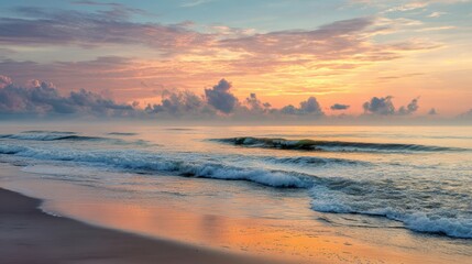 Fototapeta premium Serene Seaside at Dawn. Capturing the tranquil beauty of dawn over the ocean, soft hues paint the sky as gentle waves roll onto the shore