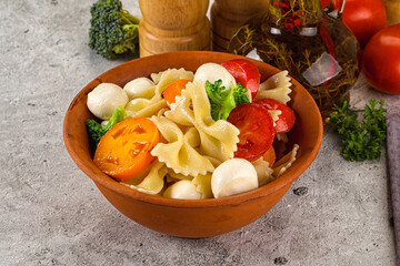 Pasta farfalle with mozzarella and tomato