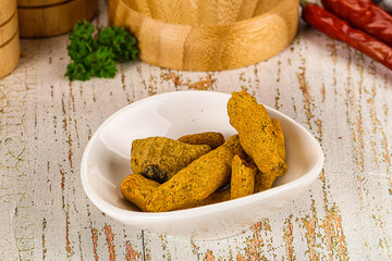 Raw dry Tumeric roots heap