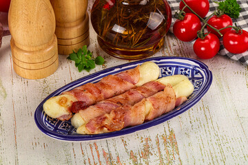 Hot mozzarella sticks with bacon