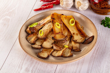 Roasted eringi mushrooms in the plate