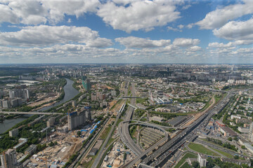 An aerial view showcasing a scenic city, complete with a flowing river and a network of numerous...