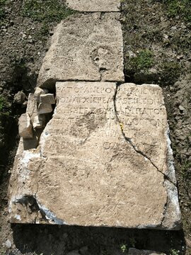 ancient ruins, Roman ruins, historical site, stone inscriptions, Latin text, Roman Empire, archaeological site, ancient city, antique architecture, old stones, Roman history, carved stone, ancient civ