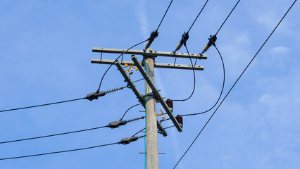 close up of electric pole with blue sky background