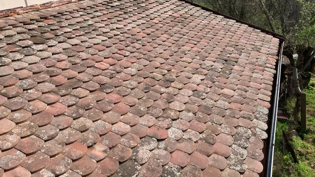 aking a look at a vintage orange tile roof built with traditional methods.